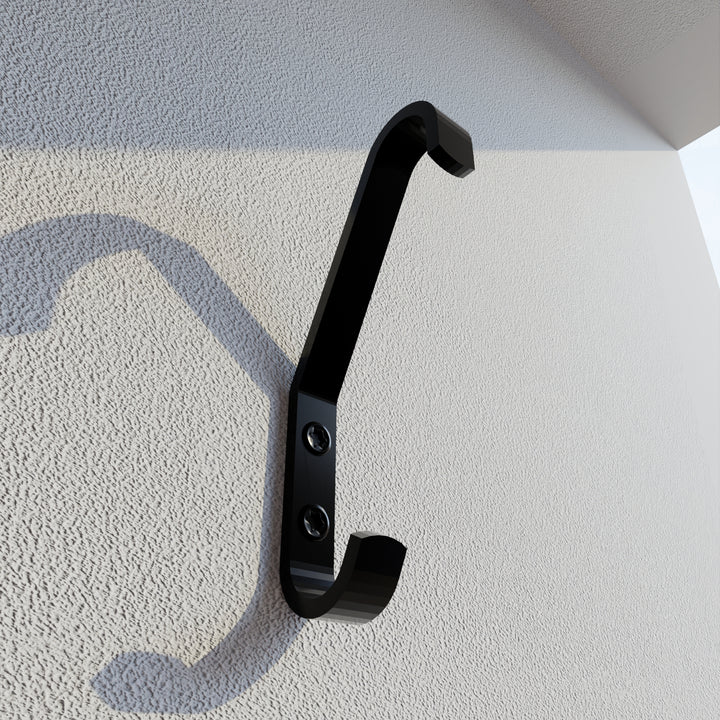 Coat hook mounted on a wall.